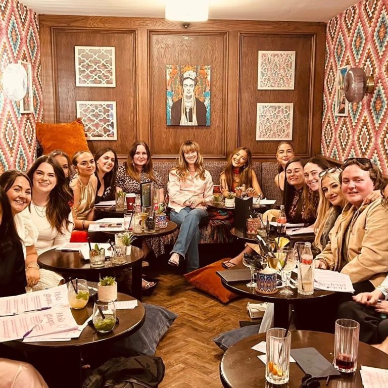 Hannah and students at Tacos y Tias special event